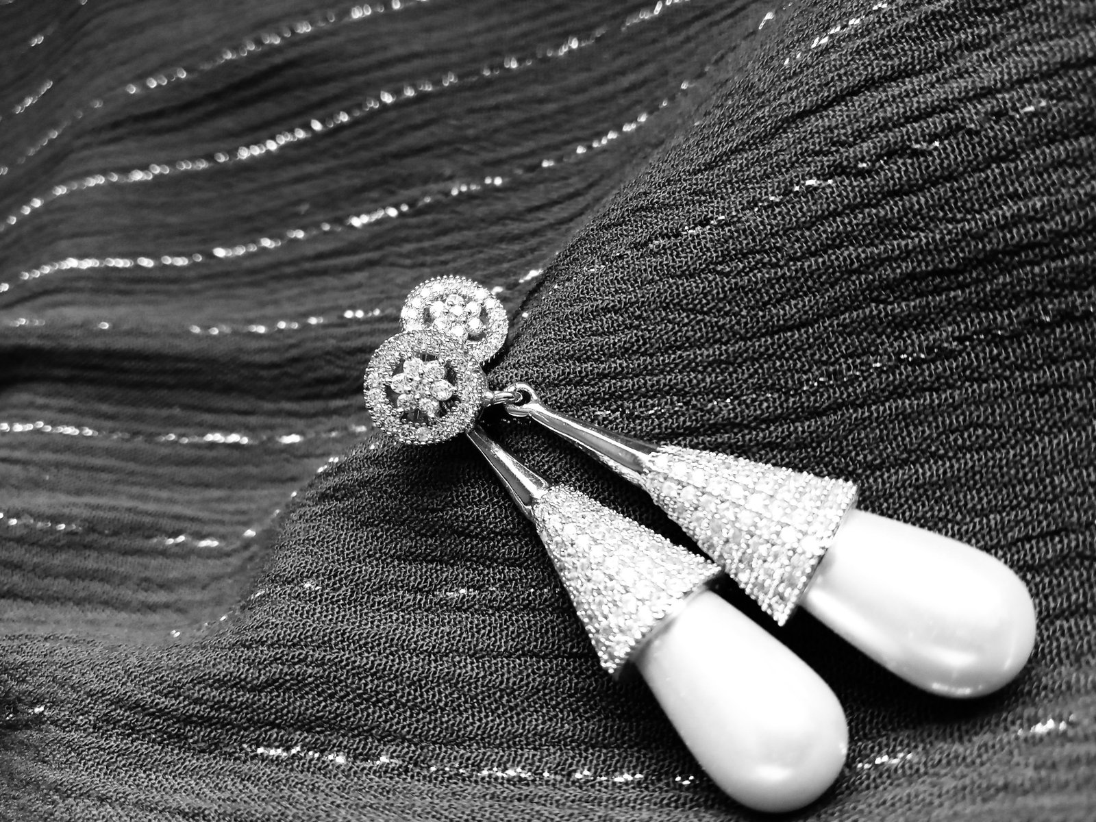 Drop earrings with pavé cone tops and pearl-like drops