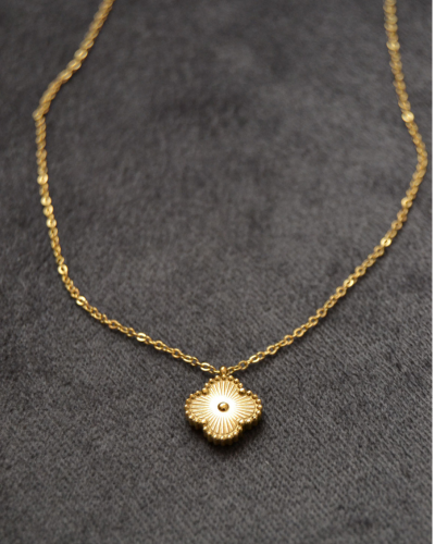 Quatrefoil gold pendant